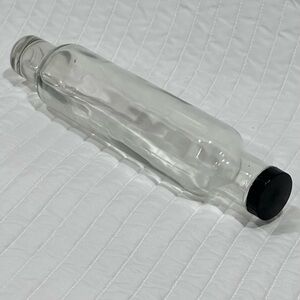 Vintage clear glass rolling pin with Black Cap